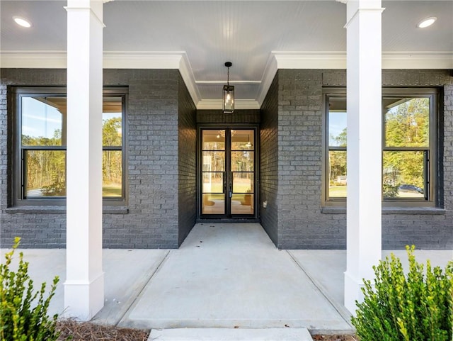 entrance to property featuring french doors and covered porch