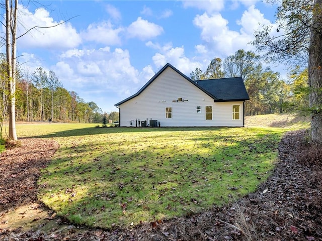 view of side of home featuring a lawn