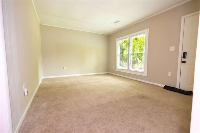 unfurnished room with light carpet and ornamental molding