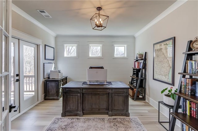 home office featuring ornamental molding, visible vents, and light wood finished floors