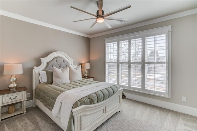 carpeted bedroom featuring a ceiling fan, visible vents, crown molding, and baseboards