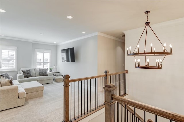 hallway with crown molding, an upstairs landing, carpet floors, a chandelier, and recessed lighting