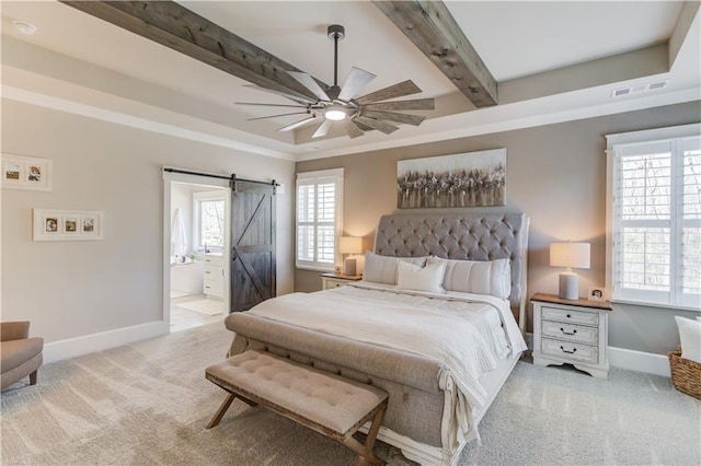 bedroom featuring beam ceiling, light colored carpet, visible vents, a barn door, and baseboards