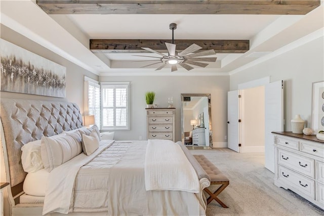 bedroom with a tray ceiling, beam ceiling, light colored carpet, and crown molding