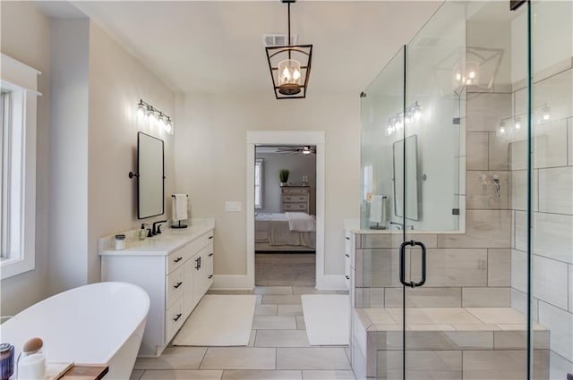 full bathroom with connected bathroom, ceiling fan with notable chandelier, vanity, visible vents, and a shower stall