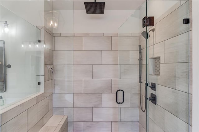 full bathroom with a stall shower and visible vents