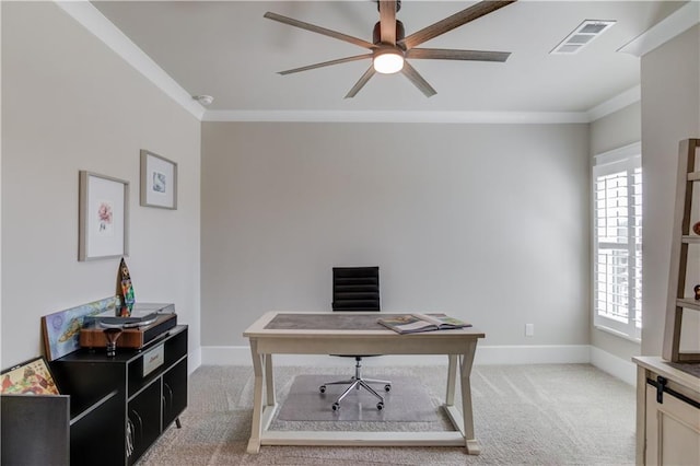 office area featuring light carpet, baseboards, visible vents, and crown molding