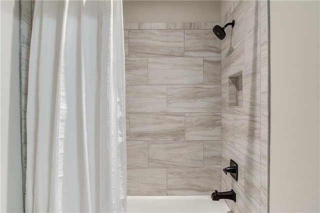 bathroom featuring shower / bath combo with shower curtain