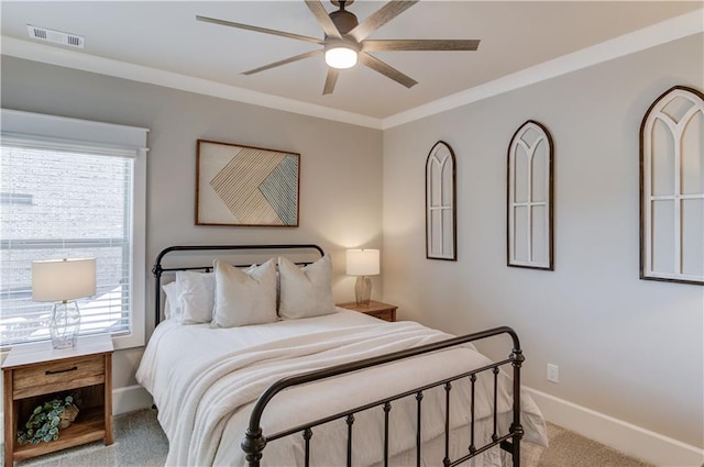 bedroom with crown molding, visible vents, a ceiling fan, light carpet, and baseboards