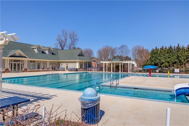 community pool with a patio