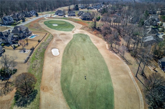 drone / aerial view featuring a residential view and golf course view