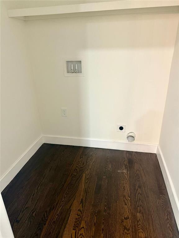 washroom featuring hookup for a washing machine, hardwood / wood-style floors, and electric dryer hookup