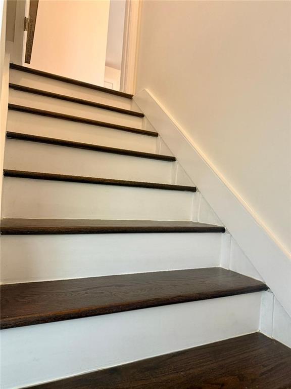 staircase featuring hardwood / wood-style floors