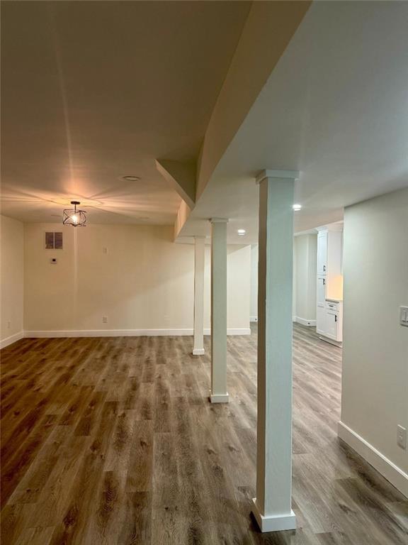 basement featuring hardwood / wood-style flooring