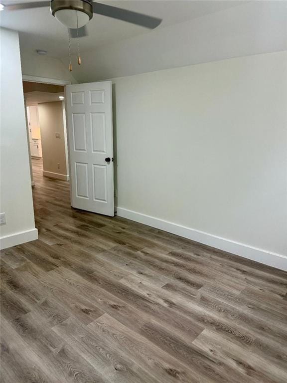 empty room featuring hardwood / wood-style flooring and ceiling fan