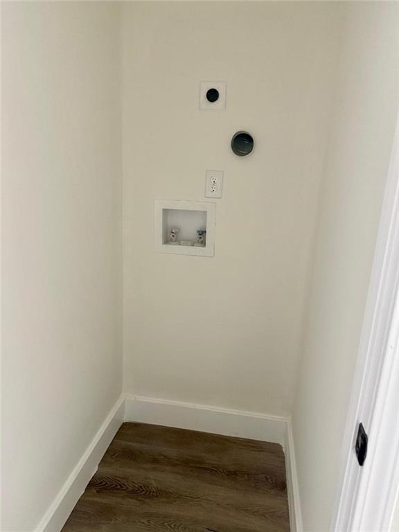 washroom with hookup for a washing machine, electric dryer hookup, and dark hardwood / wood-style flooring