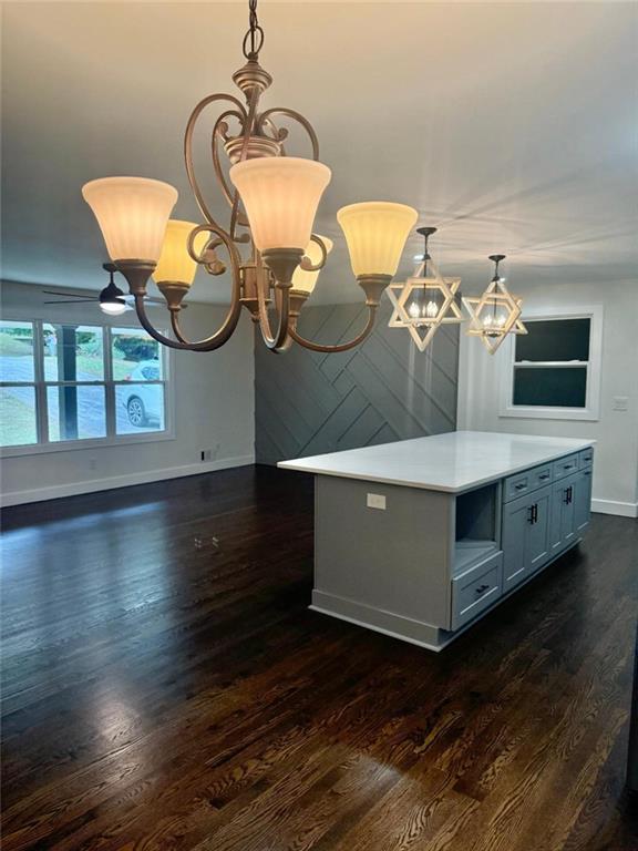 interior space with dark hardwood / wood-style flooring and a chandelier