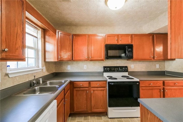 kitchen featuring electric stove, a sink, a textured ceiling, black microwave, and dishwasher