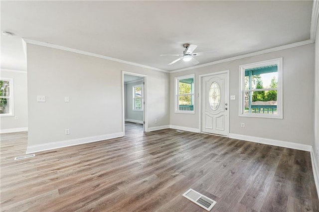 foyer entrance featuring ornamental molding, ceiling fan, and hardwood / wood-style flooring