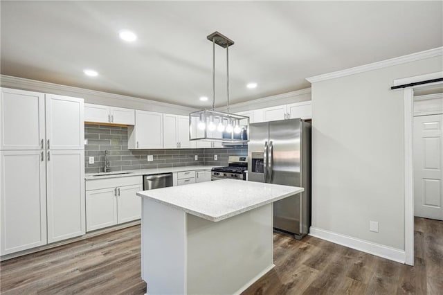 kitchen featuring stainless steel appliances, white cabinets, and a kitchen island