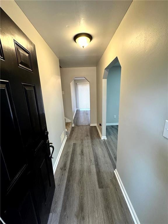 hall with dark wood-type flooring