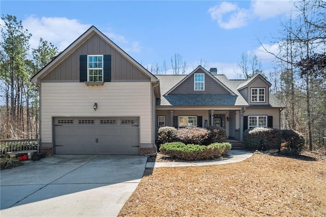 craftsman house featuring board and batten siding, concrete driveway, and roof with shingles