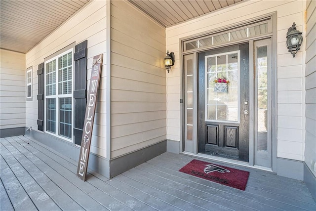 property entrance featuring a porch