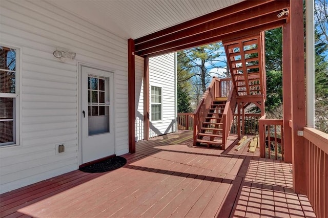 wooden deck featuring stairway