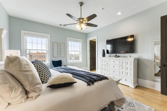 bedroom with visible vents, baseboards, light wood-type flooring, recessed lighting, and a ceiling fan