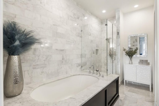 full bath with recessed lighting, a shower stall, vanity, and a garden tub