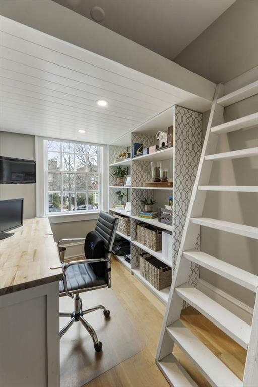 office with wood finished floors and wooden ceiling