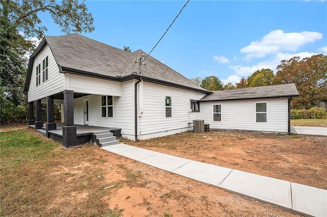 view of front of home featuring covered porch, roof with shingles, and crawl space