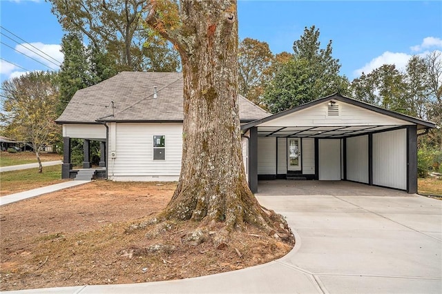 view of front of house featuring concrete driveway, a shingled roof, and crawl space