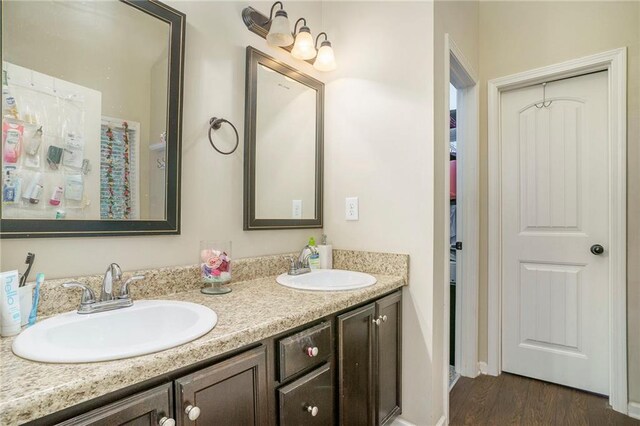 bathroom featuring wood-type flooring and vanity