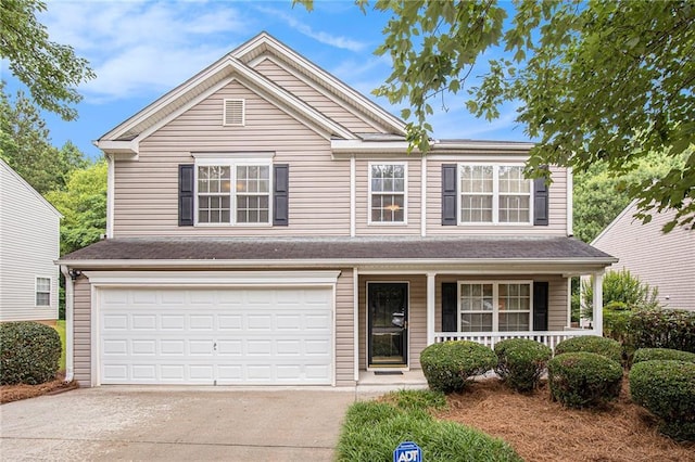 6738 Brookfield Way, Douglasville, GA 30134 - traditional-style home with covered porch, concrete driveway, and a garage