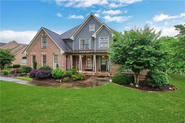 26 Trillium Ln, Acworth, GA 30101 - craftsman inspired home featuring covered porch, a standing seam roof, a front lawn, brick siding, and metal roof