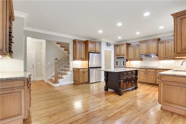 26 Trillium Ln, Acworth, GA 30101 - kitchen with stainless steel appliances, a sink, light wood finished floors, backsplash, and crown molding