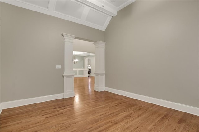 26 Trillium Ln, Acworth, GA 30101 - unfurnished room featuring light wood-style flooring, ornate columns, and baseboards