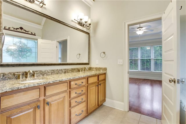 26 Trillium Ln, Acworth, GA 30101 - bathroom with crown molding, double vanity, baseboards, tile patterned floors, and a ceiling fan