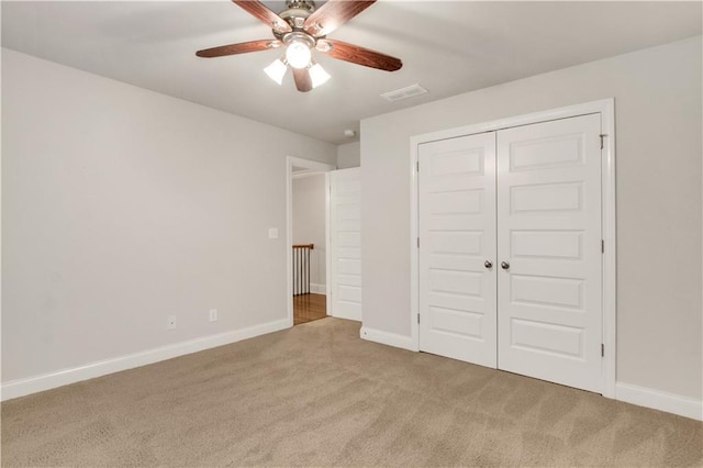 26 Trillium Ln, Acworth, GA 30101 - unfurnished bedroom with carpet, baseboards, a closet, and a ceiling fan