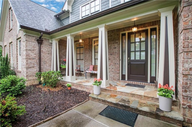 26 Trillium Ln, Acworth, GA 30101 - entrance to property with covered porch, brick siding, and roof with shingles