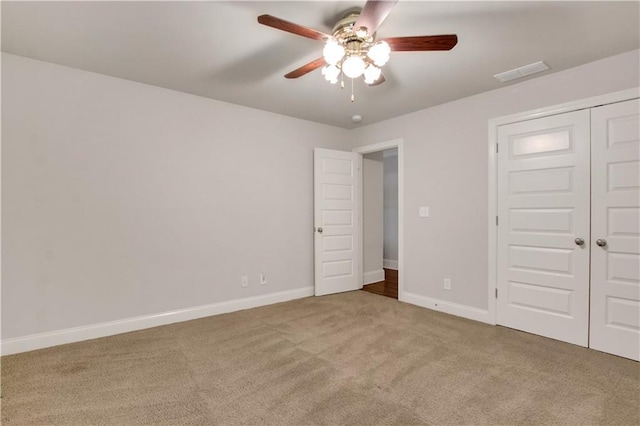 26 Trillium Ln, Acworth, GA 30101 - unfurnished bedroom featuring carpet, baseboards, a closet, and a ceiling fan