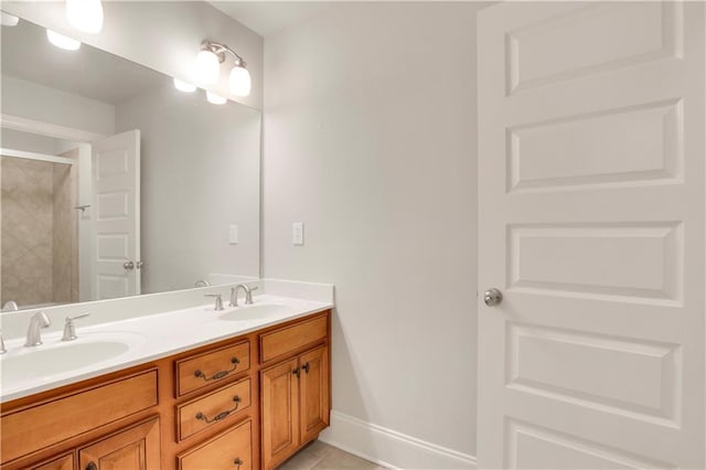26 Trillium Ln, Acworth, GA 30101 - full bathroom featuring double vanity, a shower, tile patterned flooring, and baseboards