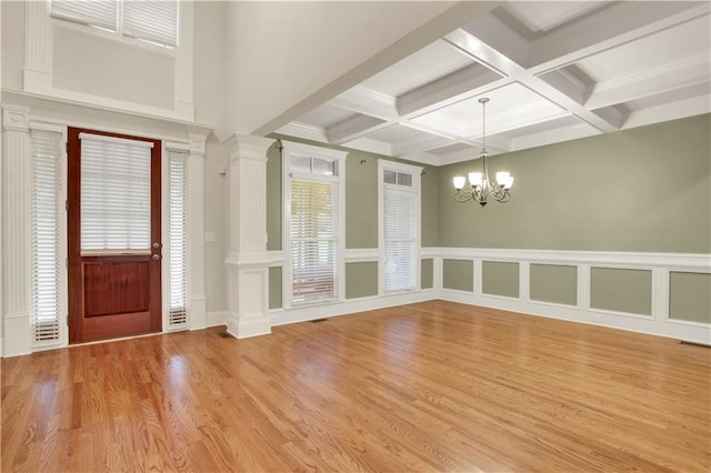 26 Trillium Ln, Acworth, GA 30101 - entryway with coffered ceiling, a chandelier, beam ceiling, light wood finished floors, and ornate columns