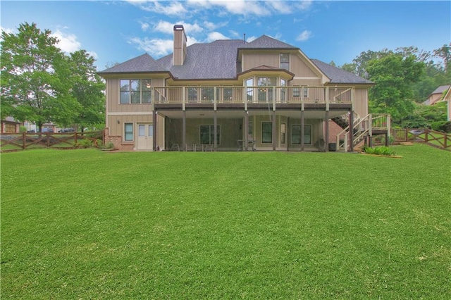 26 Trillium Ln, Acworth, GA 30101 - back of house with a chimney, a wooden deck, stairs, and roof with shingles