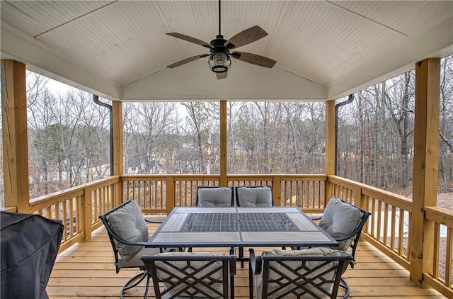 wooden deck featuring area for grilling, outdoor dining area, and ceiling fan