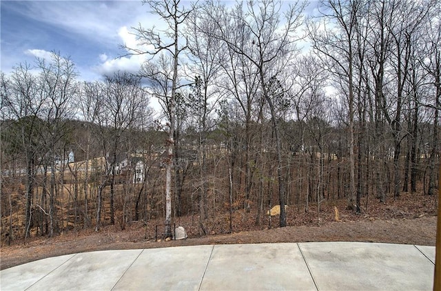 view of patio featuring a view of trees