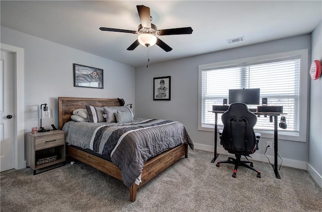 bedroom featuring visible vents, carpet floors, baseboards, and ceiling fan