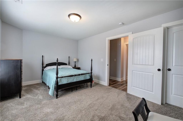 carpeted bedroom with baseboards