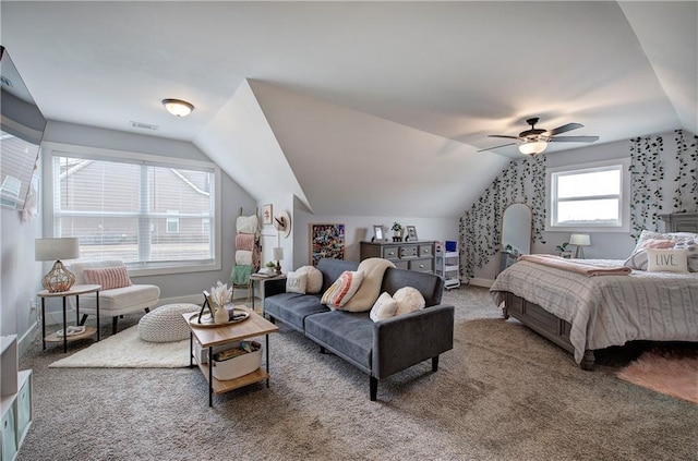 carpeted bedroom featuring visible vents, a ceiling fan, baseboards, and vaulted ceiling